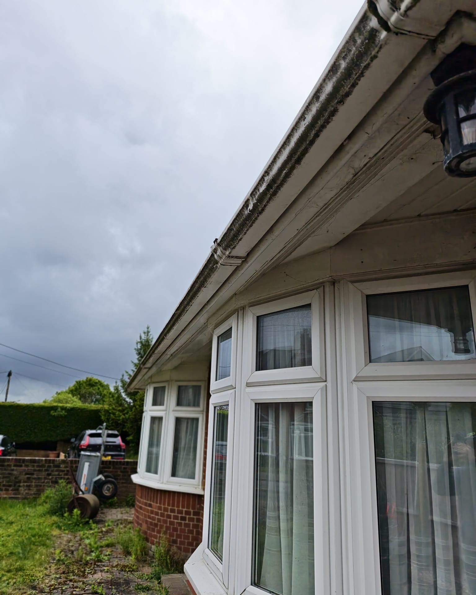Weather-stained front gutter before cleaning by OOR External