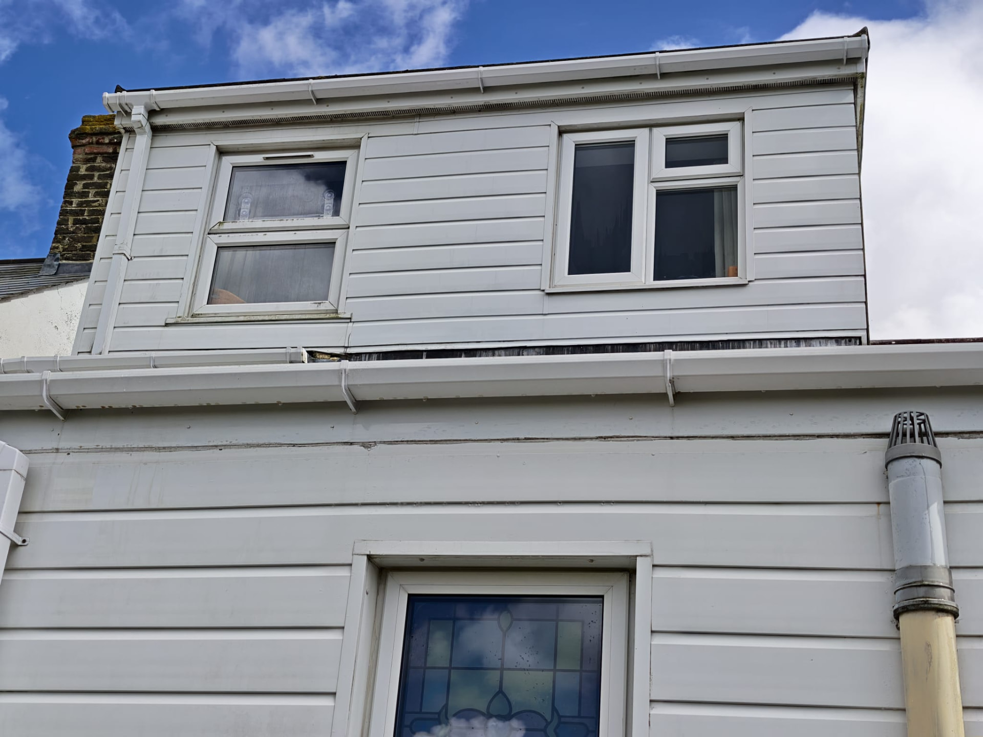 Restored white cladding after cleaning by OOR External