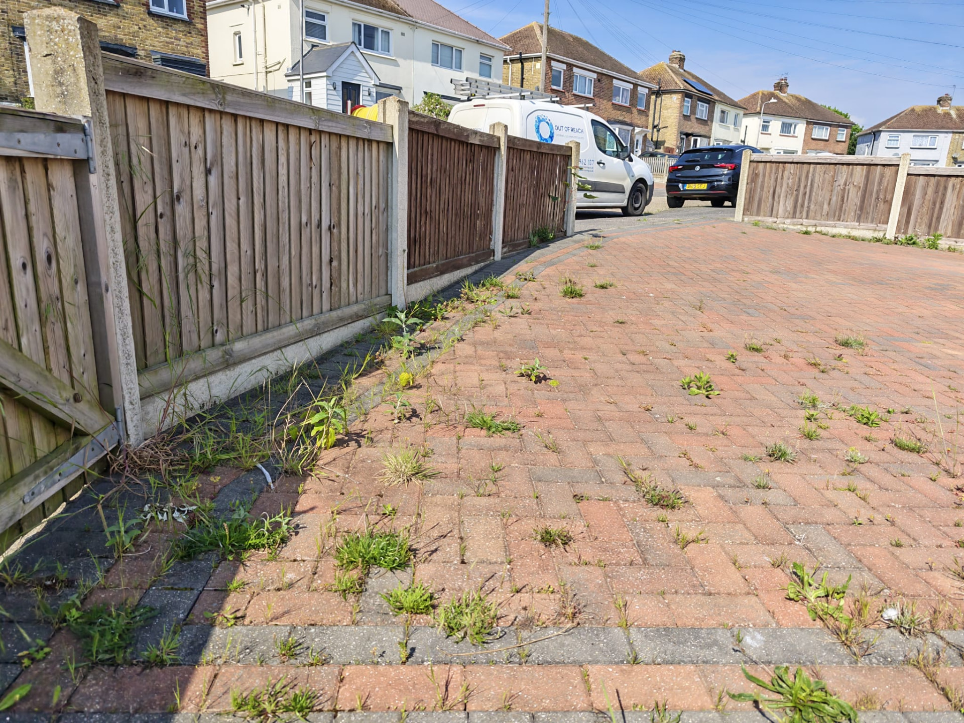 Block paved driveway with weeds before cleaning by OOR External