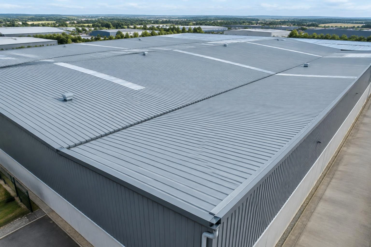 Wide profiled metal roof on a commercial warehouse
